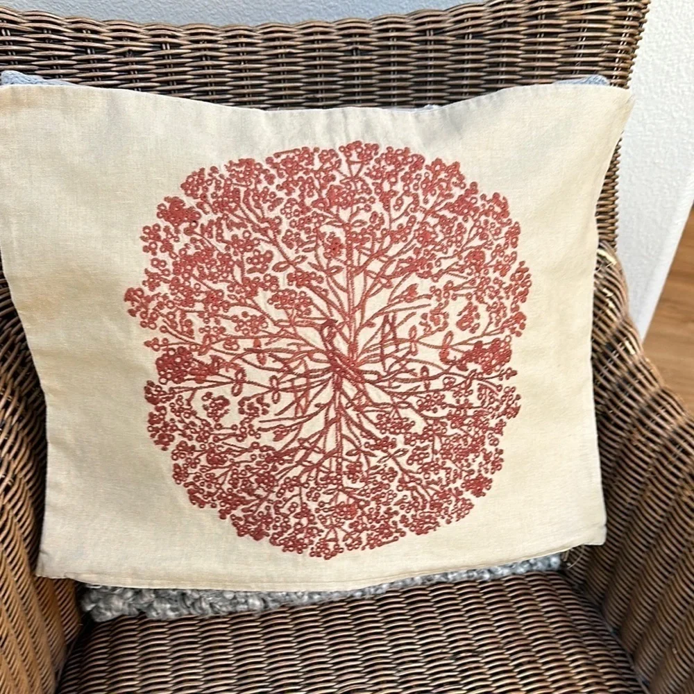 Tree embroidered pillow cover in burnt orange on tan fabric